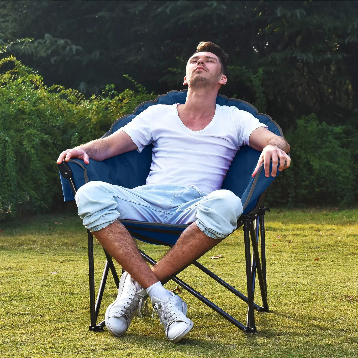 man relaxing in a blue camp chair