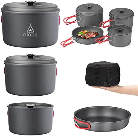 set of gray camping pans with red handles