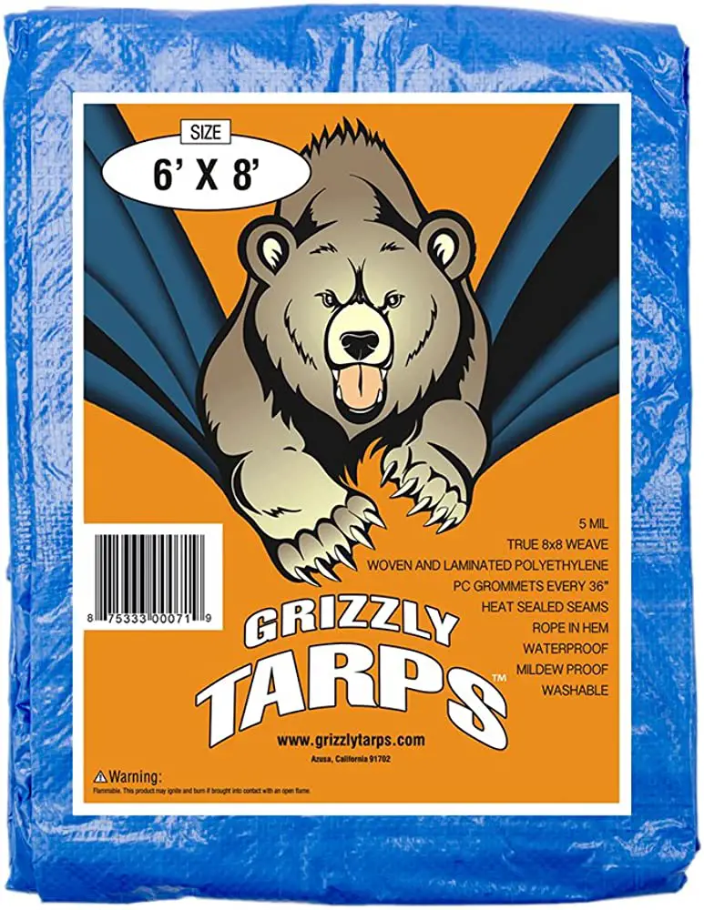 Grizzly tarp in blue with orange label and brown grizzly bear