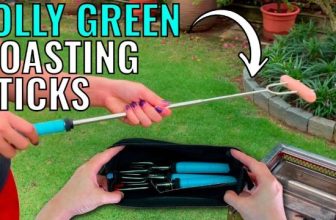 person holding a marshmallow stick that rotates