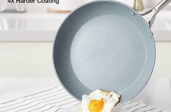 gray nonstick camp frying pan with cooked egg sliding off