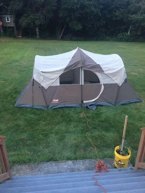 brown and tan tent set up on a lawn