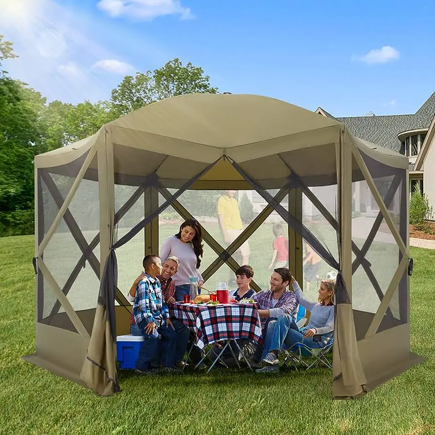 people sitting at picnic table inside pop up screen tent